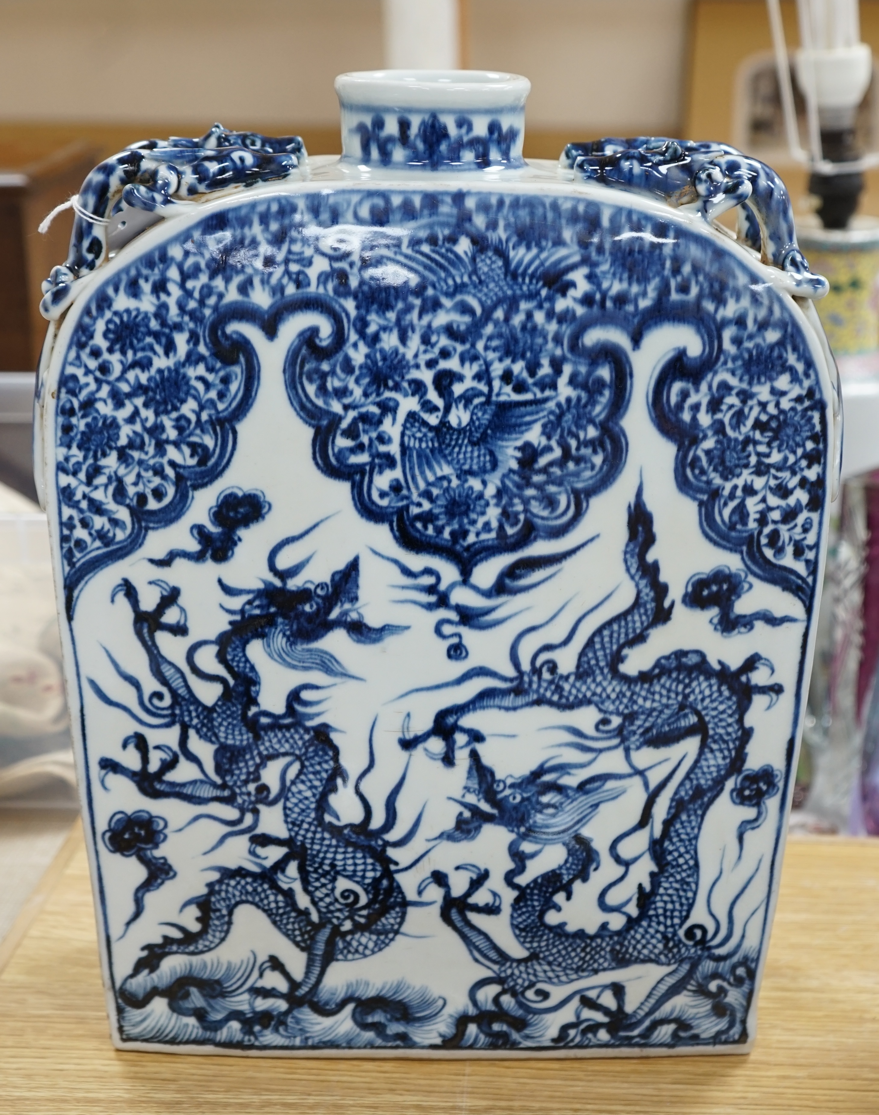 A large Chinese blue and white dragon flask, 39cm high. Condition - good